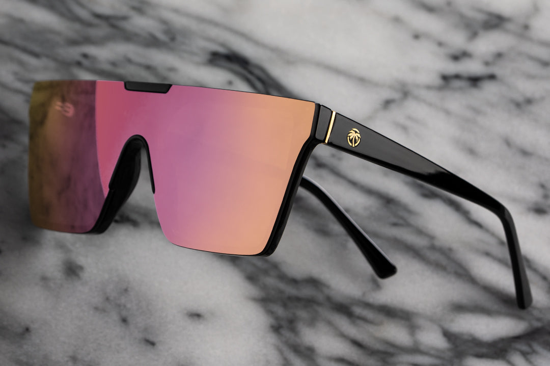 Side view of Heat Wave Visual Womens Clarity Sunglasses with black frame and rose goldlens.