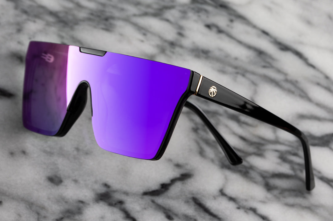 Side view of Heat Wave Visual Womens Clarity Sunglasses with black frame and ultra violet lens.