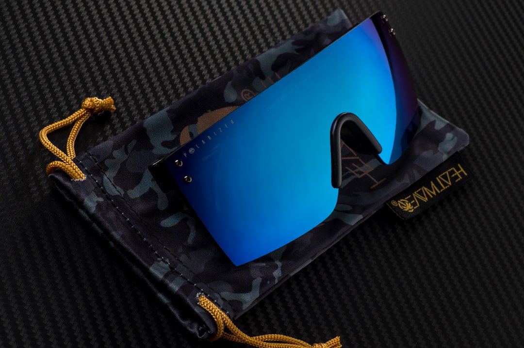 Heat Wave Visual Lazer Face Z87 Sunglasses with black frame and polarized galaxy blue lens on top of a microfiber. 