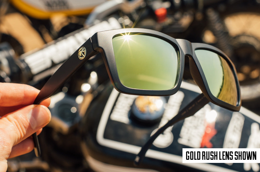 Side View of Heat Wave Visual XL Vise with black frame and gold lenses in front of a Harley.