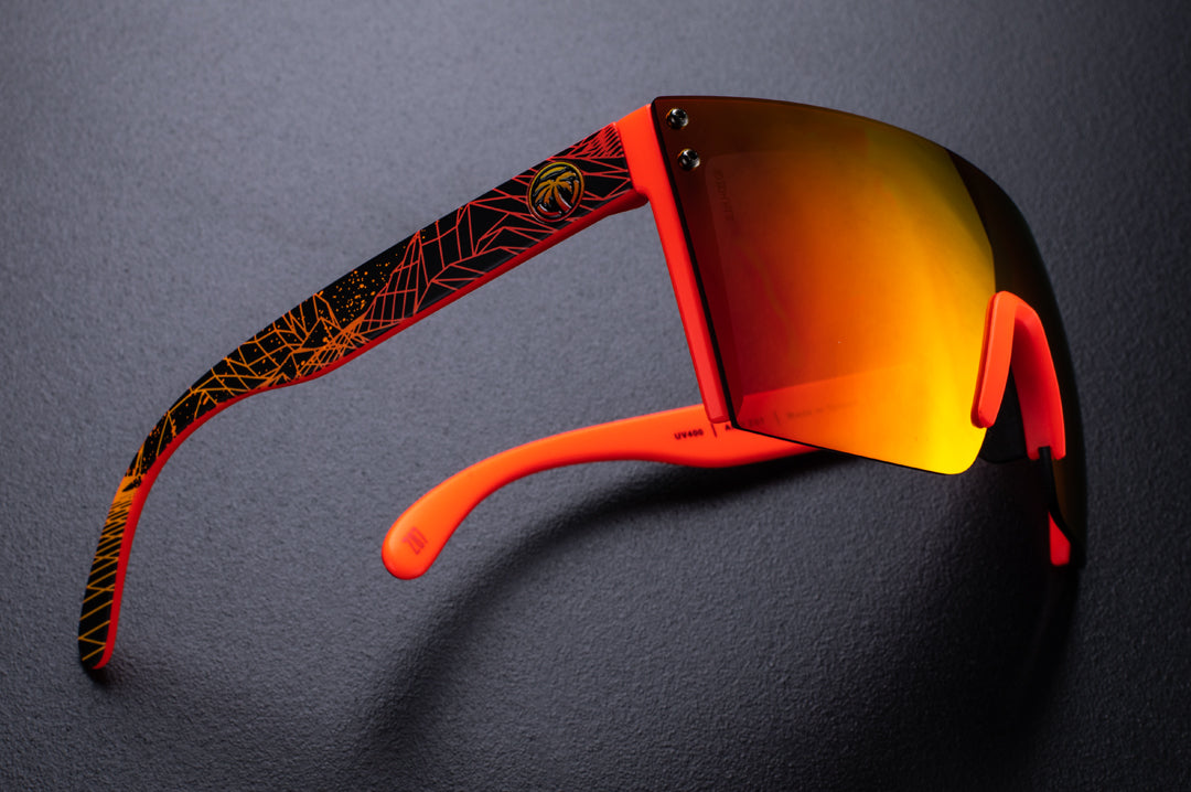 Side view of Heat Wave Visual Lazer Face Z87 Sunglasses with neon red frame, girdwave print arms and firestorm red lens.
