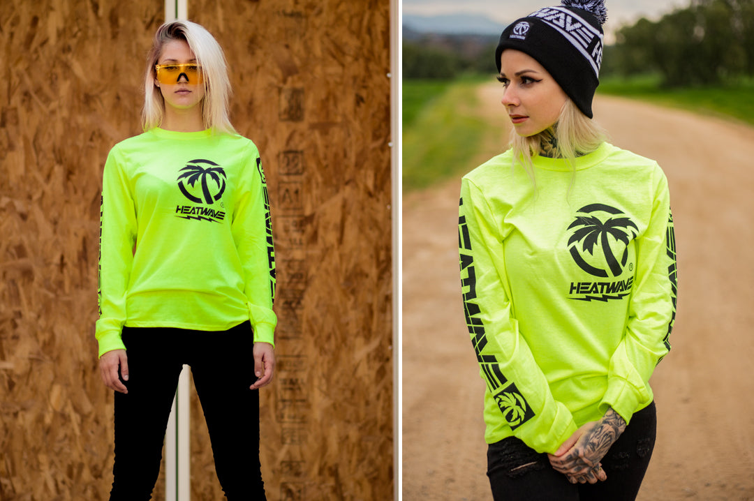 Two women wearing Heat Wave Visual Hi-Vis Bolt Long Sleeve with bolt graphic print.