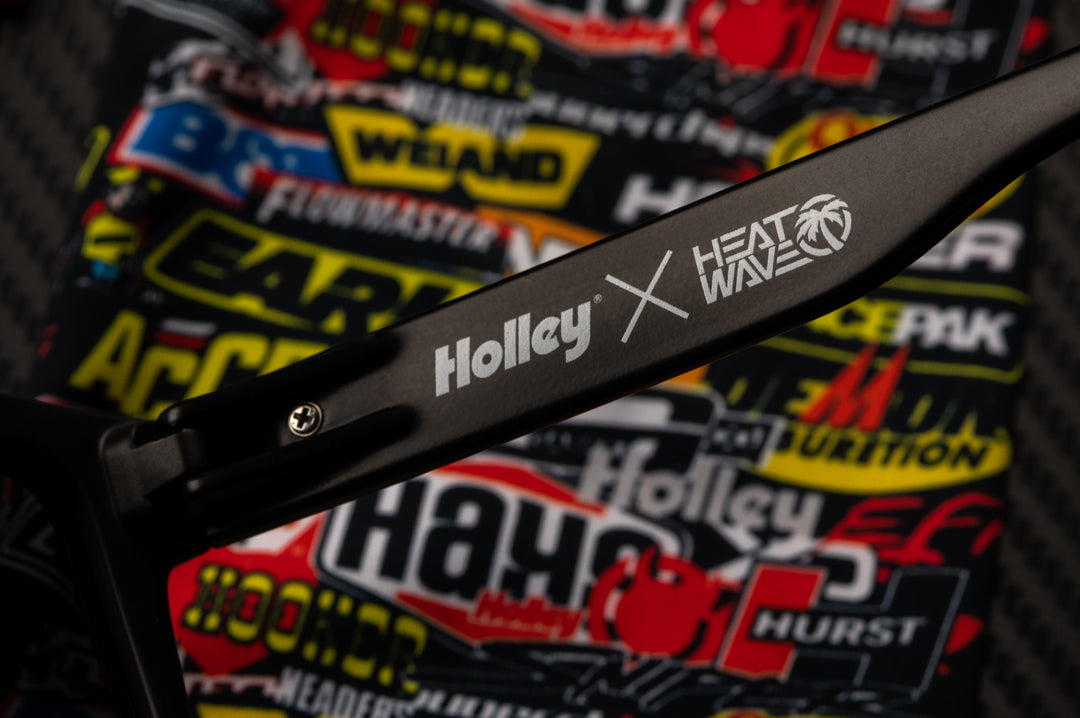 Close up of the inner arm of the Heat Wave Visual Vise Sunglasses with black frame, holley print arms and black lens.