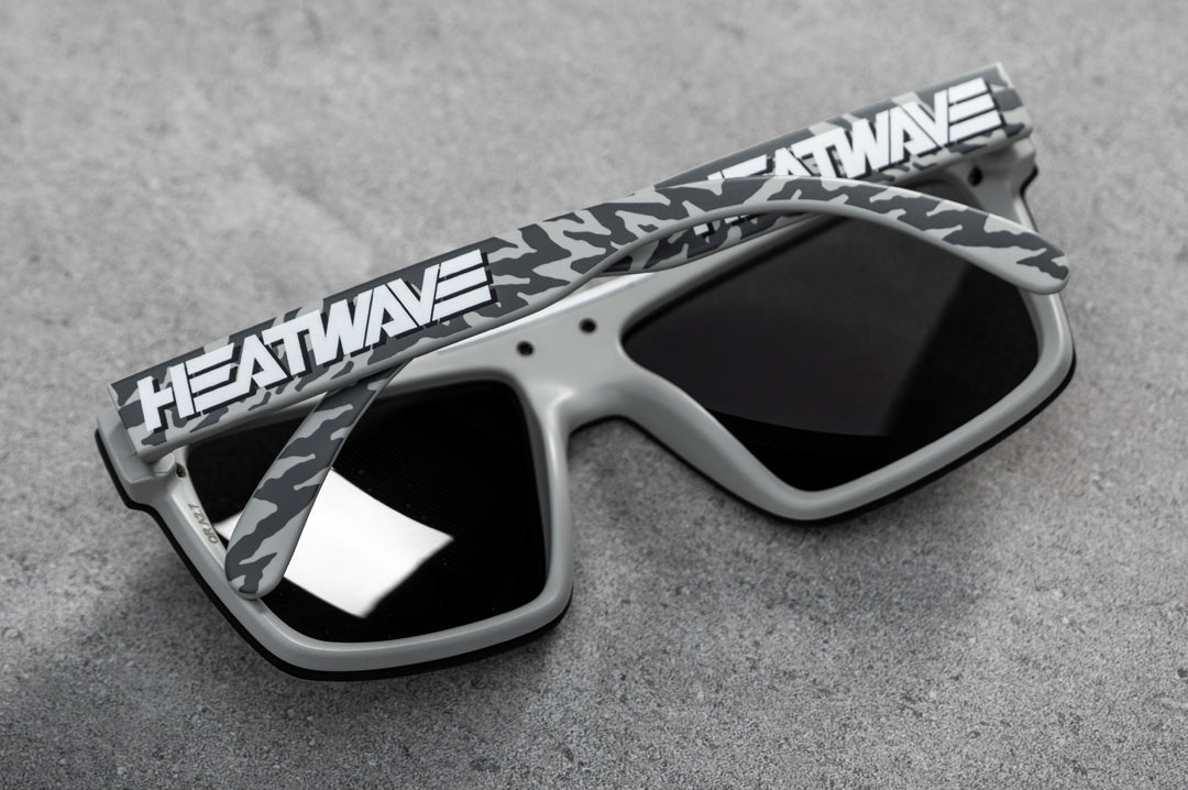 Back of Heat Wave Visual Quatro Sunglasses with light grey frame, white logo print arms and black lens.