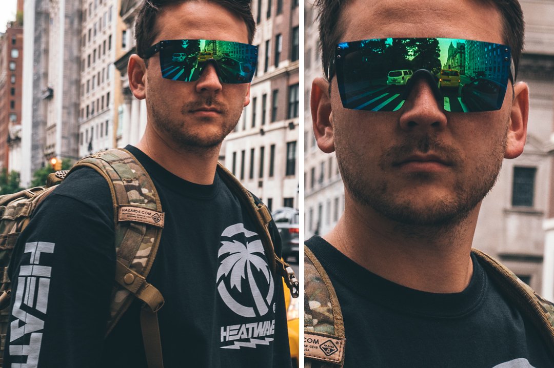 Lost Tourist in busy downtown wearing Heat Wave Visual Lazer Face Z87 Sunglasses with black frame and piff green lens.