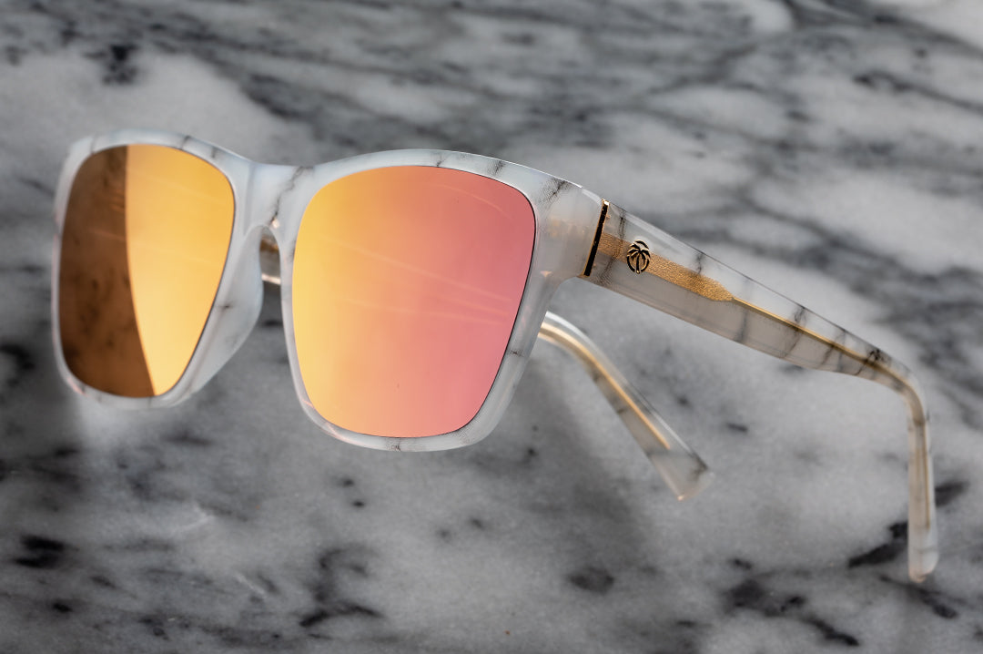 Close up of Heat Wave Visual Womens Marylin Sunglasses with marble frame and rose gold lenses.