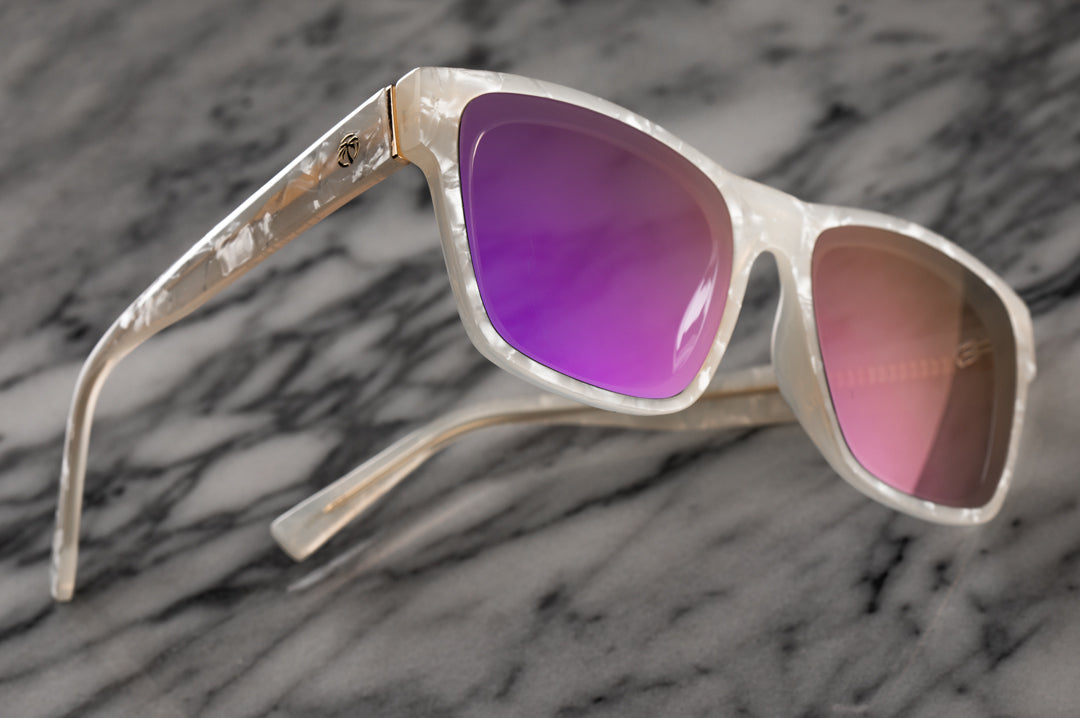 Side view of Heat Wave Visual Womens Marylin Sunglasses with pearl white frame and fuchsia lens.