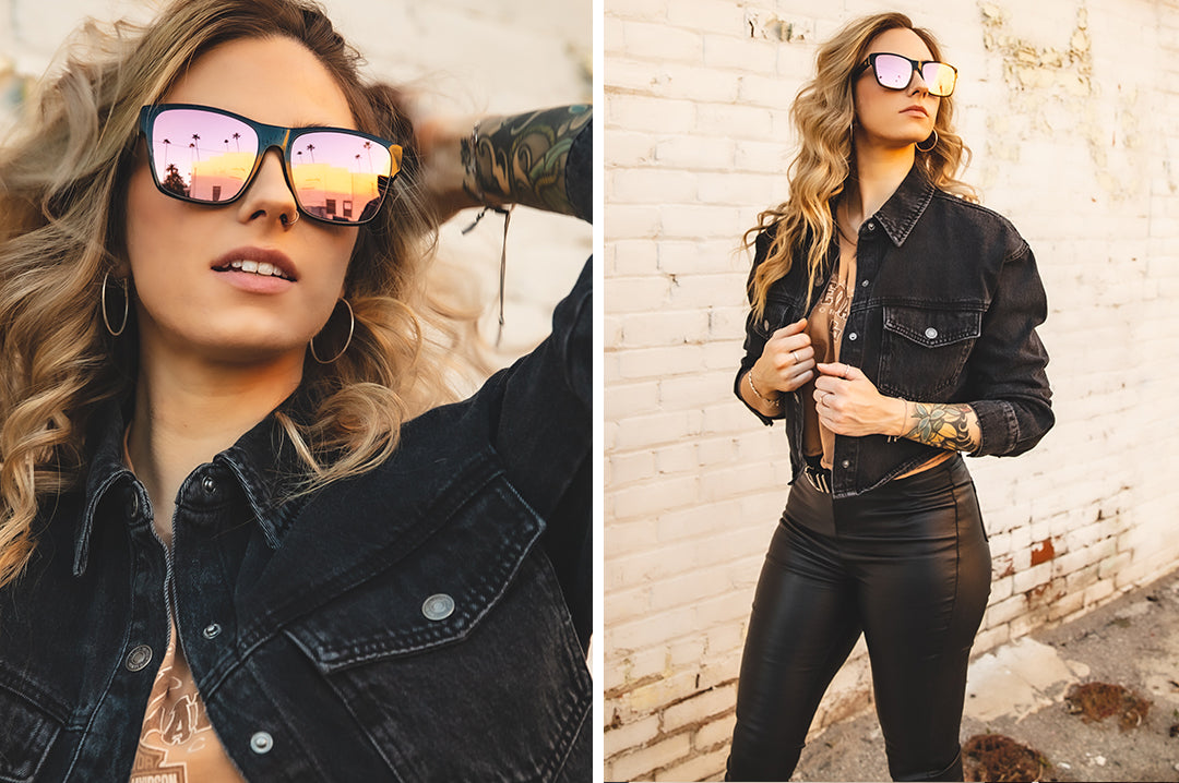 Young woman wearing Heat Wave Visual Womens Marylin Sunglasses with black frame and rose gold lenses.
