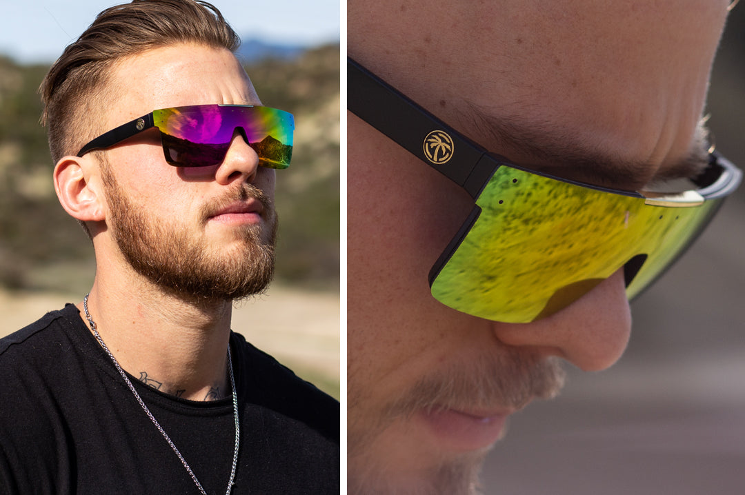 Young Bearded guy wearing Heat Wave Visual Quatro Sunglasses with black frame and spectrum pink yellow lens.