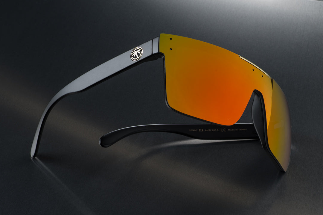 Side view of Heat Wave Visual Quatro Sunglasses with black frame and sunblast orange yellow lens.