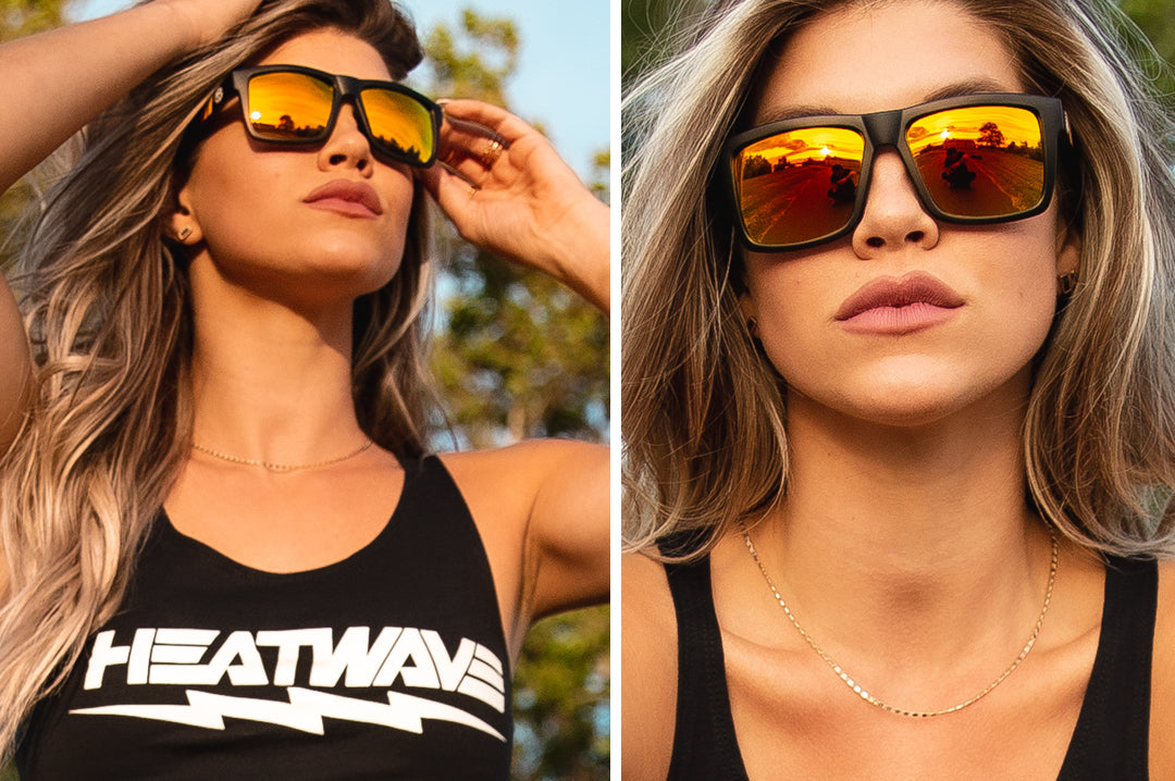 Young women wearing Heat Wave Visual sunglasses black frame with sunblast orange lenses.
